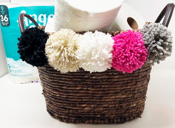 pom pom basket filled with toilet paper 2