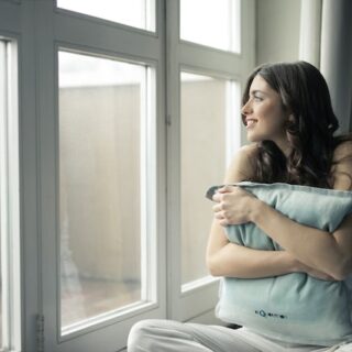 women holding pillow